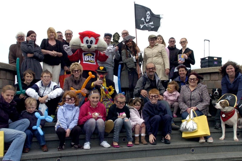 Morecambe Day supporters gather at the Eric Morecambe Statue.