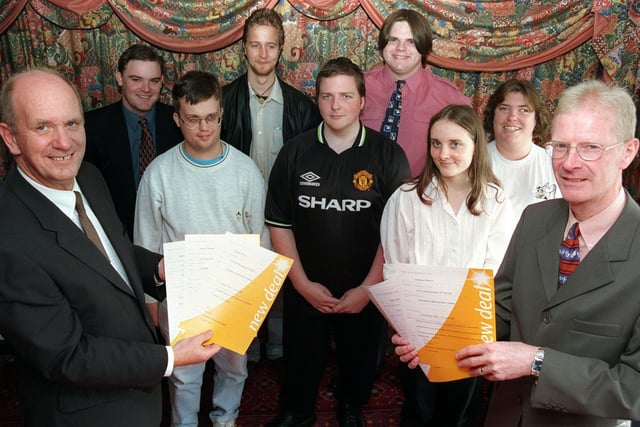 Principal of Lancaster and Morecambe College, David Roddam (left) and Brian Shannan (right), from Employment Services, present students from the college with their New Deal certificates.