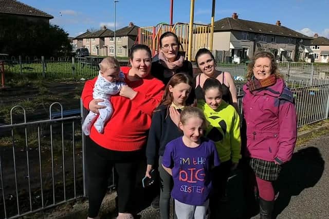 Members of Friends of Marsh and children celebrate their funding success outside the derelict Sycamore Grove play park. Back row from left: Nicola Blackhurst, Katie Schad (chair of the Friends), Alison Woodhouse, and Coun Mandy Bannon.