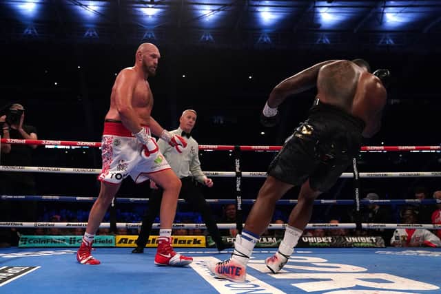 Tyson Fury (left) knocks down Dillian Whyte with what would be the final punch of the fight