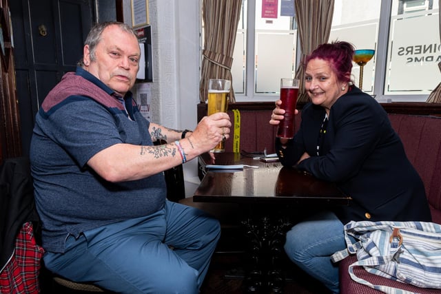 David and Susan Burrow have a drink inside the Joiners Arms.