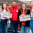 Danyl Johnson from People's Postcode Lottery with some of the lucky Lancaster winners, Isobel, Ria, Sara and Amie.