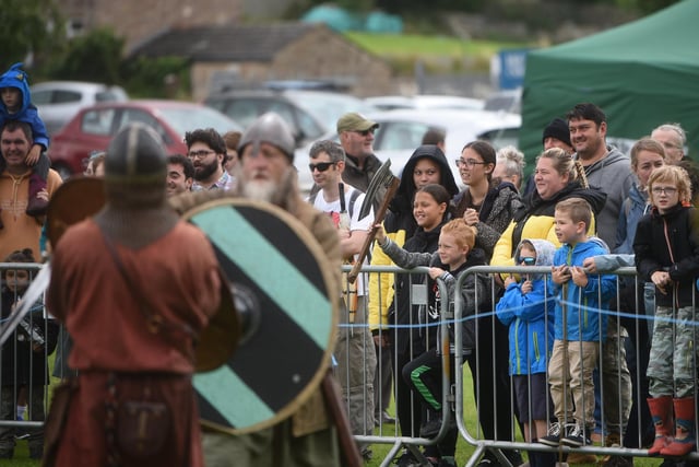 Onlookers brave the wet weather to see the battle re-enactment at Heysham Viking Festival. Picture by Daniel Martino.