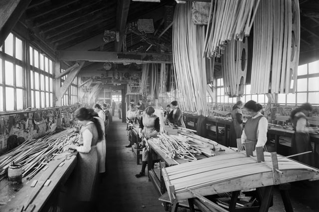 Female workers involved in the production of biplane wings at the Waring and Gillow factory, St Leonard's Gate, Lancaster, in January 1917. Photographer: H Bedford Lemere.