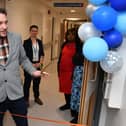 Jon Richardson prepares to cut the ribbon at the opening of the new RLI Urology Department.