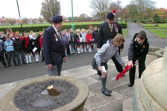 Children from Shakespeare Primary School in Fleetwood are first to try community project designed to raise awareness of Remembrance Day and create more respect for war memorials among young people. Head boy Michael Head and head girl Megan Gair lay a wreath at the base of the memorial in 2006