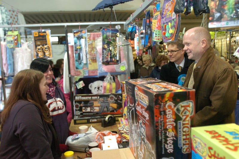 Shadow Foreign Secretary, William Hague, with prospective parliamentary candidate for Morecambe and Lunesdale, David Morris, chats to Claire Marsland and Diana Shaw from the toy stall, during a pre election visit to the Festival Market in Morecambe on Easter Monday in 2010.