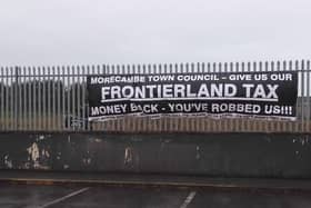 Protest banner regarding Morecambe Town Council and the 'Frontierland tax'. Picture: Roger Cleet