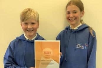 Caton St Paul's sports captains Jacob Sutton and Beatrice Woodcock holding the certificate.