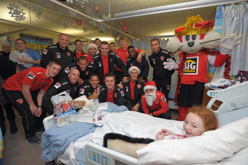 Eleven year old Elinor Taylor from Morecambe with Morecambe FC during their visit to the RLI Children's Ward and Orthopaedic Ward.