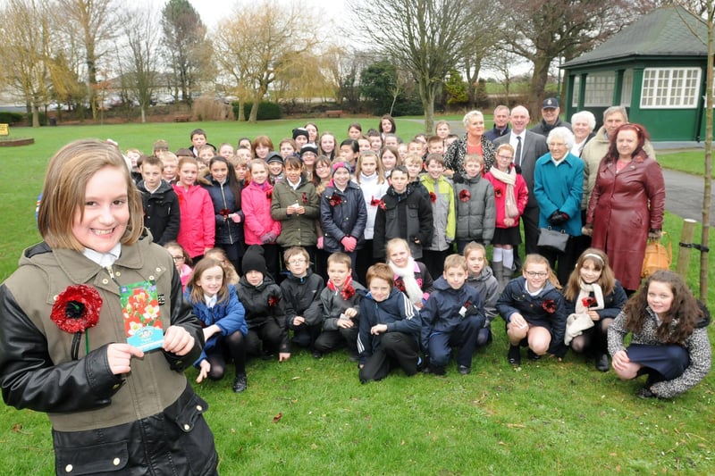 Pupils from Westgate Primary School and Morecambe High School and organisers and councillors at the launch of a poppy scatter in Happy Mount Park.