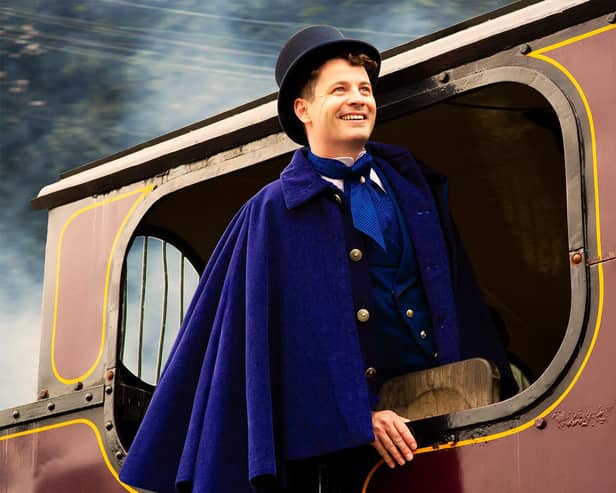 Philleas on a train engine in Around The World In 80 Days. Picture by Gabi Dawkins.
