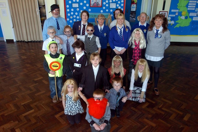Pupils dressed as staff and members of staff dressed as pupils for Red Nose Day at Our Lady of Lourdes Primary School in Carnforth.