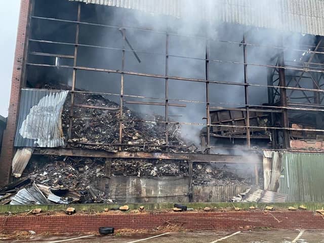 The scene of the large fire in Lancaster which involved 30,000 tonnes of industrial waste. Pockets of fire are still being uncovered at the site by waste removal teams.