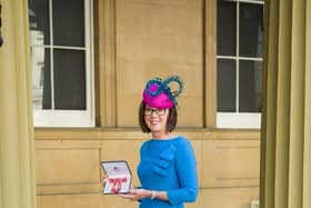 Lancaster University Professor Jo Rycroft-Malone at Buckingham Palace with her OBE.