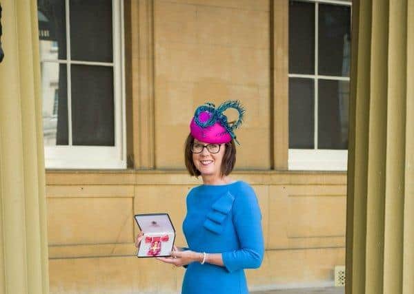 Lancaster University Professor Jo Rycroft-Malone at Buckingham Palace with her OBE.
