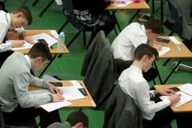 Nationally top GCSE grades are down on last year but higher than pre-pandemic