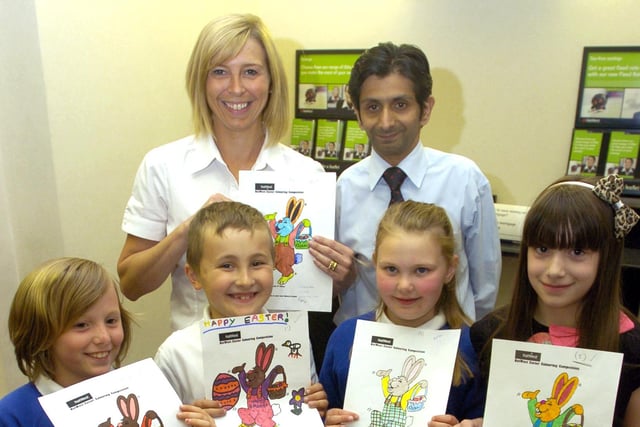 Manager of NatWest, Central Promenade, Morecambe, Imtiaz Munshi and customer services officer Vicki Hood with prizewinners in an Easter painting competition, Sophie Harwood, Jessica Cleal, Elise Brien, James Parsons (on behalf of his sister Rebecca) and Ava Barker (not pictured) all from St Peter's CE School, Heysham.