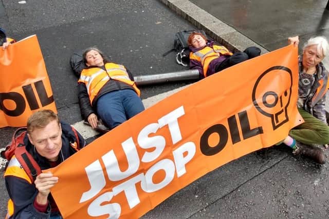 Sandra Elsworth (middle, lying down) during the Just Stop Oil protest in London.