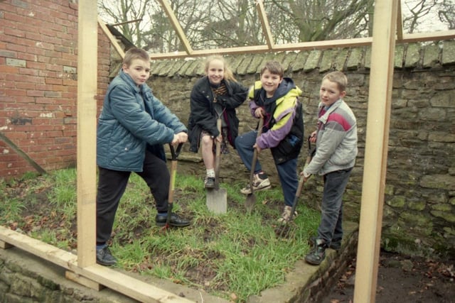 Butterfly-barmy youngsters at a tiny Lancashire school are winging their way towards building their own butterfly house. The 16 children at Bleasdale CE Primary School, near Garstang, are all aflutter at the prospect of nurturing their own butterflies. Pictured: Anthony Lockett, Joanne Whiggintham, Neil Brown and Gavin Faraday working on the butterfly house
