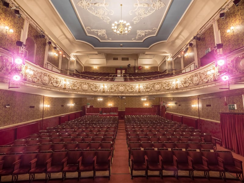 The Grand Theatre, under its many names, has been a major part of the social and cultural life of Lancaster since it opened in 1782. In 1897, Frank Matcham, one of the best known theatre architects, designed and supervised an extensive re-modelling of the stage and auditorium. In 1908, a major fire gutted the interior of the Grand, virtually destroying Matcham’s work. Phoenix-like, less than eight months later, it reopened in an Edwardian design maintained to the present day. In 1951, ABC Cinemas, the then owners, sold the theatre to Lancaster Footlights - the society who currently own it under a trust arrangement -and purchased it to secure the venue for amateur drama and music in the city. In 1959, the Footlights were served with a Compulsory Purchase Order as part of the St Leonardgate/Edward Street clearance for a relief road and industrial zone. This was cancelled in 1960. In 1978, the emergency (gas) lighting system was found to be unsafe and the theatre was threatened with closure. Funds to install an electrical system were raised by means of fundraising events. By 1979, it was becoming clear that major expenditure would be needed to halt the gradual deterioration of the building. Lancaster Footlights became a registered charity in 1972 and launched the first of four covenant-based fundraising schemes which raised more than £667,000. These schemes provided funding for specific projects designed to restore and improve the theatre. Today, as a result of a continual restoration drive, the theatre is in the best condition it has been since the rebuild in 1908 and now operates as one of the key north west venues for amateur drama, music and dance, and professional touring companies.