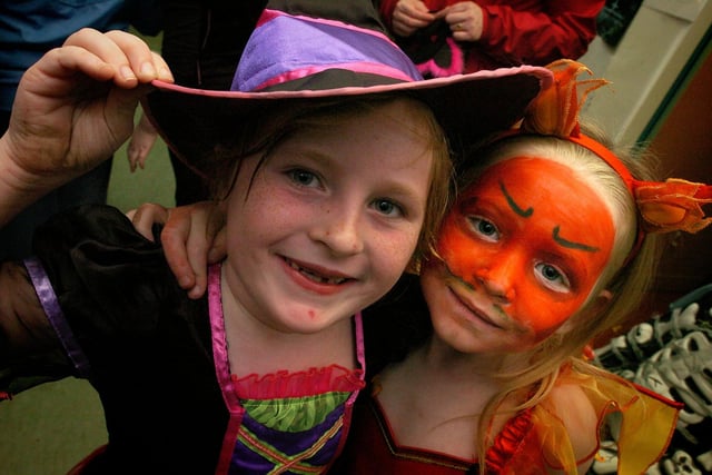 Lucy Wenlock aged six and Josie Taylor (seven) dress up and have fun at Skerton Guides, Brownies and Rainbows' Hallowe'en party in the community centre. (unknown date).