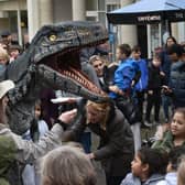 Dinsoaurs walk the streets during last year's Dino Day in Lancaster.