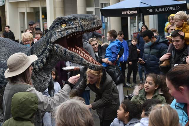Dinsoaurs walk the streets during last year's Dino Day in Lancaster.