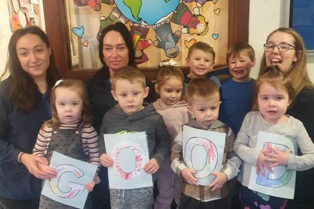 Staff and children at Rising Stars Nursery in Lancaster celebrate their Ofsted report