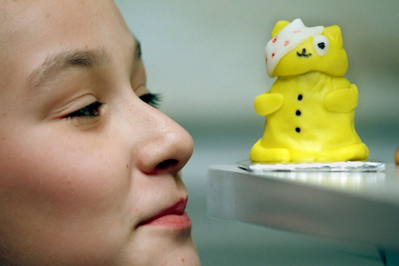 Pupil Lindsey Rodmell takes a closer look at one of the Pudsey bear cakes she made in aid of Children in Need.