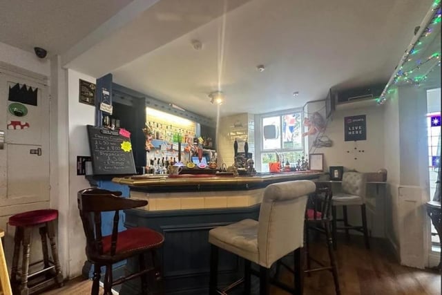 The cozy bar area at The Nib in Millhead.