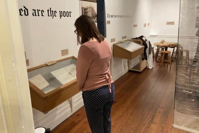 Lancaster City Museum's co-manager, Rachael Bowers reading some of the documents on display in the Going to East Road exhibition.