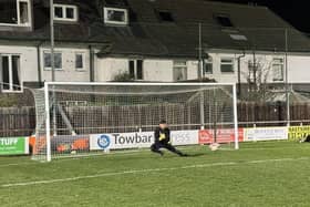 ​Tom Stewart warms up at Whitby Town ahead of his excellent debut for Lancaster  Photo: LANCASTER CITY FC