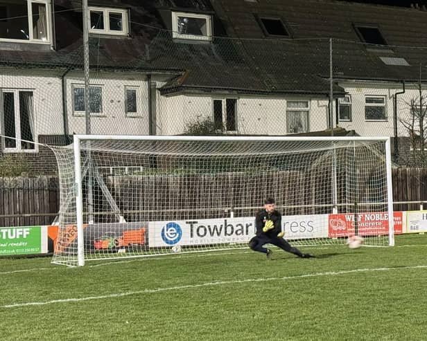 ​Tom Stewart warms up at Whitby Town ahead of his excellent debut for Lancaster  Photo: LANCASTER CITY FC