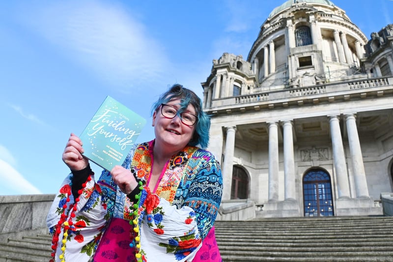 Lancaster writer and motivational speaker, Sally Hope, in the park with her new book, 30 Steps to Finding Yourself.