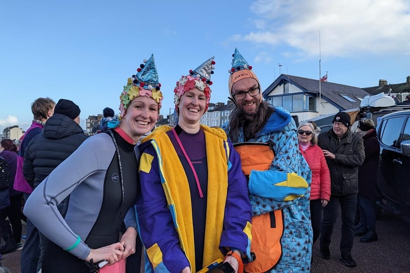 Three people dressed up to take part in the New Year's Day Dip in Morecambe Bay.
