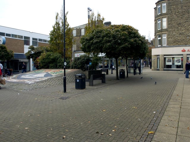 Morecambe town centre in 2009 with the mosaic still in place outside The Arndale. The mosaic now resides on the promenade near the RNLI shop.