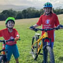 Nicole and Luca on their bikes for their charity mountain biking challenge.