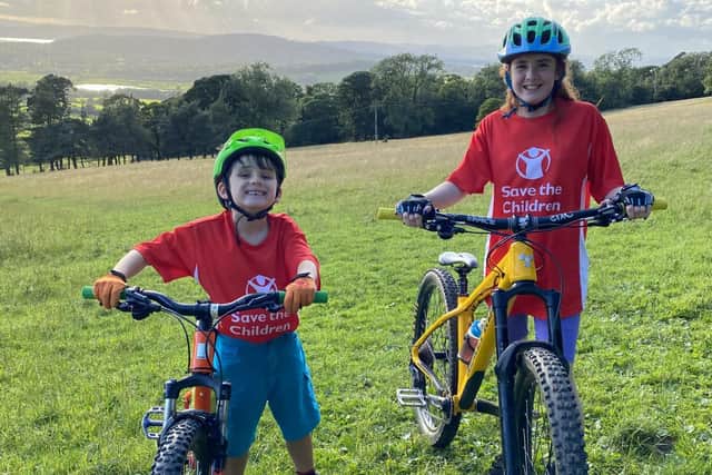 Nicole and Luca on their bikes for their charity mountain biking challenge.