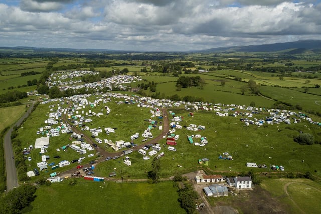 Aerial view of the travellers campsite on the outskirts of Appleby-in-Westmorland, Cumbria.  June 9, 2022.  See SWNS story SWLEfair.  Thousands of travellers from across Europe have begun to arrive in Cumbria as the Appleby Horse Fair gets underway.  More than 30,000 people are expected to gather in the small town of Appleby-in-Westmorland and neighbouring Kirkby Stephen for the annual event. The 250-year-old fair is billed as the largest traditional gathering of the Gypsy, Romany and travelling communities in Europe. 