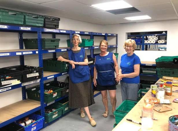 Volunteers Diane, Sue and Val, pictured with some of the empty shelves at Morecambe Bay Foodbank.