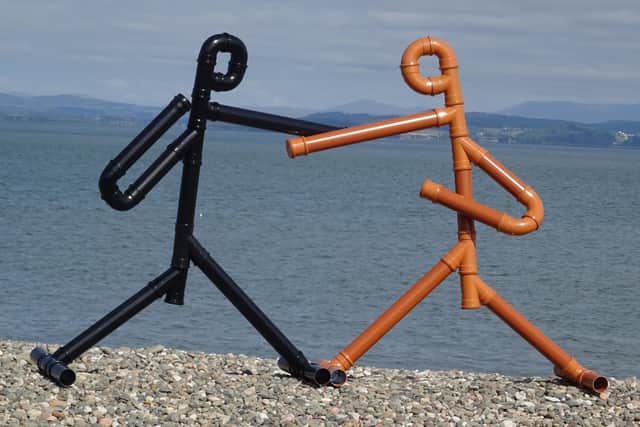Drainpipe sculptures of Tyson Fury and Anthony Joshua at Morecambe Bay. Picture by Anthony Padgett.