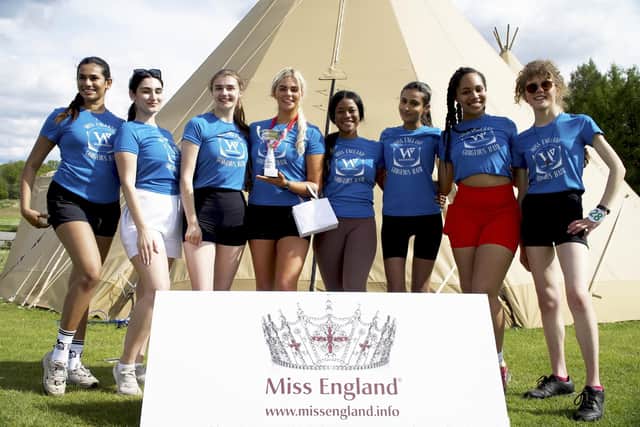 Melissa Butcher (fourth left) with her trophy. Picture courtesy Miss England/SWNS.