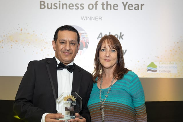 Business of the Year winner Ashok Jhalley of Morecambe Bay Chemist receives his award from Victoria Carte, Lancaster & Morecambe College's head of engagement.