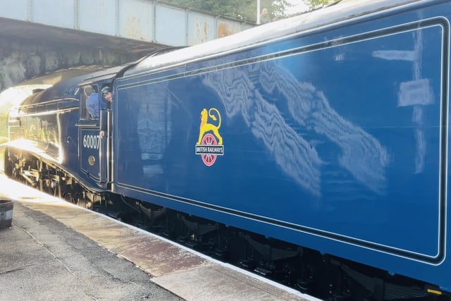 The train sports BR blue livery.