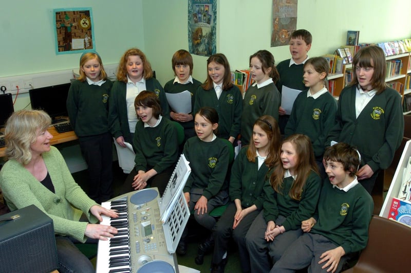 The school choir from Ellel St John's C.E. Primary School, pictured practising with music teacher Mrs Dunne for their concert at Scotforth Methodist Church in aid of Year of the Child in 2009.