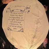 A Chinese lantern is released into the air to remember the lives lost in the Morecambe Bay tragedy.