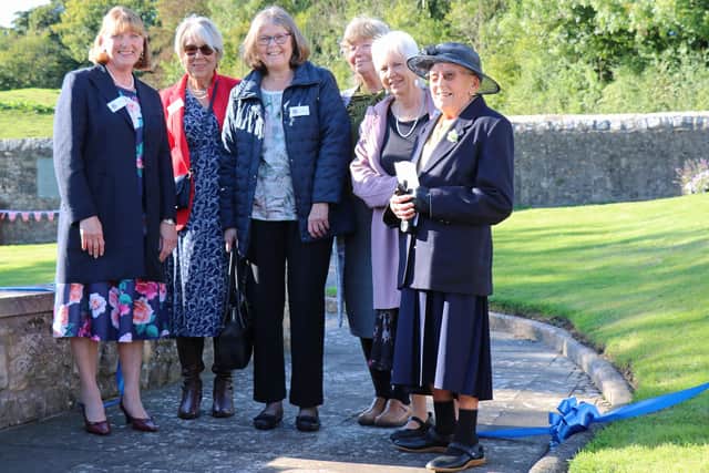 Members of Halton Gardening Group with Joan Richards, who opened the garden.