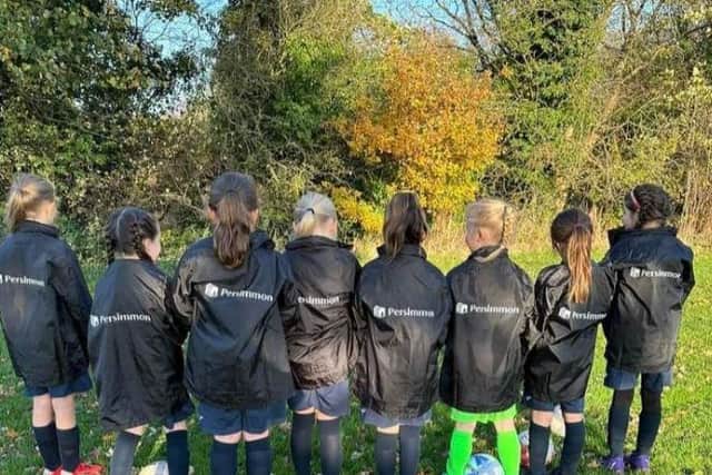 Morecambe Girls FC’s Under 8s team in their new jackets.