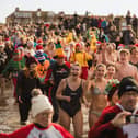 Hundreds go into the water at the New Year's Day Dip in Morecambe Bay. Picture by Richard Hislop.